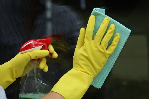 Cleaner preparing deep cleaning equipment safely