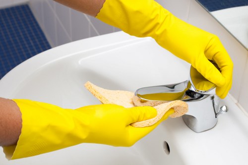 Team member following safe working practices during deep cleaning